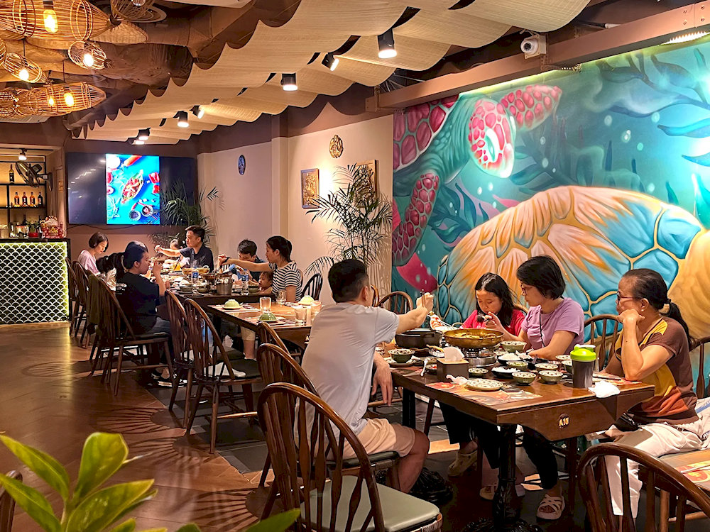 A warm and inviting space where the rich aroma of bagridae fills the air, perfect for enjoying authentic cha ca in comfort 